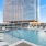 Resort-style swimming pool with lounge seating