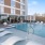 Resort-style swimming pool with lounge seating