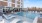 Resort-style swimming pool with lounge seating
